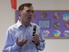 Minister of Finance Bill Morneau speaks with the media after touring a day care centre earlier this week.
