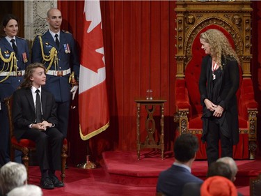 Julie Payette looks to her son Laurier as she makes her first speech as Canada's 29th Governor General from her seat in the Senate chamber during her installation ceremony, in Ottawa on Monday, October 2, 2017.