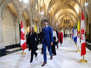 Canada's incoming Governor General Julie Payette walks with Prime Minister Justin Trudeau as she arrives on Parliament Hill in Ottawa on Monday, Oct. 2, 2017, for her installation ceremony.