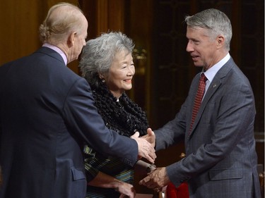 MP Andrew Leslie, right, speaks with former Governor General Adrienne Clarkson, centre, and husband John Ralston Saul as guests assemble for the installation of Canada's next Governor General, Julie Payette, in Ottawa on Monday, October 2, 2017.