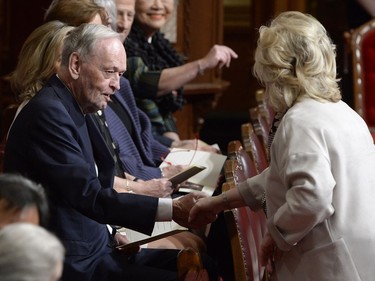 Former Canadian Prime Minister Jean Chretien greets Senator Pamela Wallin as guests assemble for the installation of Canada's next Governor General, Julie Payette, in Ottawa on Monday, October 2, 2017