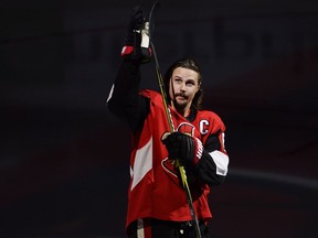 Injured Ottawa Senators defenceman Erik Karlsson (65) acknowledges the home crowd during player introductions prior to NHL hockey action against the Washington Capitals in Ottawa on Thursday, October 5, 2017. Karlsson is not in today's lineup. THE CANADIAN PRESS/Adrian Wyld ORG XMIT: JFJ504
Adrian Wyld,