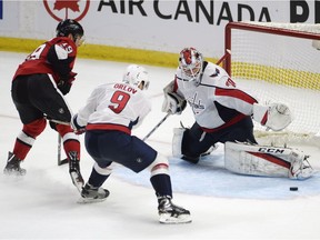 Capitals goalie Braden Holtby stops a shot by Senators centre Derick Brassard (19) in overtime of Thursday's game. THE CANADIAN PRESS/Adrian Wyld