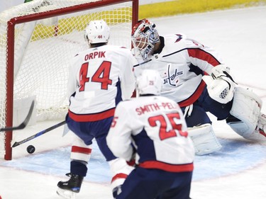 Washington Capitals goalie Braden Holtby (70) pulls the puck our of the net after being scored on by Ottawa Senators defenceman Chris Wideman (not shown) as Brooks Orpik (44) and Devante Smith-Pelly (25) look on during first period NHL hockey action in Ottawa on Thursday, October 5, 2017. THE CANADIAN PRESS/Adrian Wyld ORG XMIT: JFJ501
Adrian Wyld,