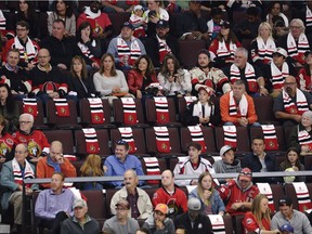 Scarves mark empty seats in the crowd as the Ottawa Senators take on the Washington Capitals in their season opener at the Canadian Tire Centre on Thursday, October 5, 2017. The building was slightly less than full for Game 1.
