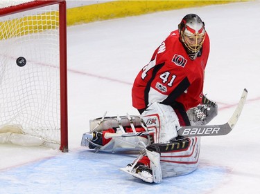 A shot by the Devils' John Moore gets past Ottawa Senators goalie Craig Anderson for the game-winning goal in overtime.