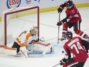 The Ottawa Senators' Tom Pyatt waits for the pass from teammate Mark Borowiecki in front of Philadelphia Flyers goalie Michal Neuvirth during the first period at the CTC on Thursday, Oct. 26, 2017.