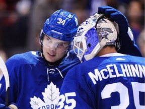 Maple Leafs centre Auston Matthews (34) celebrates with goalie Curtis McElhinney after Wednesday's victory against the Red Wings in Toronto. THE CANADIAN PRESS/Nathan Denette