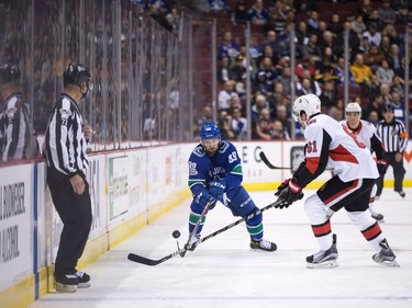 Vancouver Canucks' Sam Gagner (89) shoots the puck past Ottawa Senators' Mark Stone (61) during first period NHL hockey action in Vancouver on Tuesday, October 10, 2017.