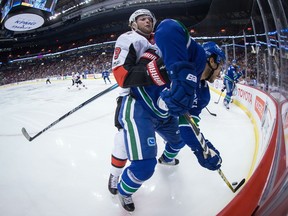 Ottawa Senators' Bobby Ryan, left, checks Vancouver Canucks' Michael Del Zotto during first period NHL hockey action in Vancouver on Tuesday, October 10, 2017. Ryan has performed well for the Senators in the early going.