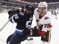 Ottawa Senators' Thomas Chabot (72) checks Winnipeg Jets' Marko Dano (56) during second period NHL pre-season game action in Winnipeg on Wednesday, September 27, 2017. The Ottawa Senators assigned defencemen Thomas Chabot and Ben Harpur to AHL Belleville on Sunday.