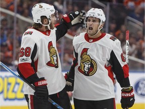 The Senators' Chris Wideman, right, celebrates a goal with Mike Hoffman. Wideman went into a game against the Devils tied for the league lead in goals by a defenceman with three.