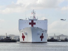 In this photo provided by the U.S. Navy,  the Military Sealift Command hospital ship USNS Comfort arrives in San Juan, Puerto Rico, on Tuesday, Oct. 3, 2017. Comfort will help support Hurricane Maria aid and relief operations.   (U.S. Air Force Capt. Christopher Merian/U.S. Navy via AP) ORG XMIT: NY107

AP PROVIDES ACCESS TO THIS PUBLICLY DISTRIBUTED HANDOUT PHOTO PROVIDED BY U.S. NAVY; MANDATORY CREDIT.
Capt. Christopher Merian, AP
