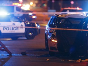 An officer's hat is seen on the ground as Edmonton Police Service officers investigate after a man attacked a police officer outside of an Edmonton Eskimos game at 92 Street and 107A Avenue in Edmonton, Alberta on Sunday, October 1, 2017.