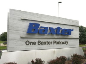 FILE - This July 2009 photo shows the sign outside Baxter International Inc. in Deerfield, Ill. Drug and medical product maker Baxter says it expects a near-term shortage of small bags of saline solution, widely used in hospitals to hydrate patients and mix with intravenous medicines, due to Hurricane Maria temporarily shutting down its operations in Puerto Rico. (George LeClaireDaily Herald via AP)