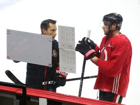 Bobby Ryan listens to Guy Boucher make a point during a practice in the late September. Ryan credits the Senators head coach for helping him deal with off-ice issues last season. Jean Levac/Postmedia