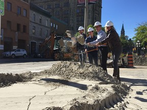 Court Curry, manager of right of way, heritage and urban design services, Rideau-Vanier Coun. Mathieu Fleury, Mayor Jim Watson and ByWard Market BIA executive director Jasna Jennings break ground on a new plaza at York St and Sussex Drive where the big Ottawa sign will be relocated.