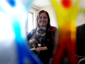 Jenn Coward and her kitten, Ivy, are seen through the Inspiration Award from the Royal. Coward speaks publicly about her obsessive compulsive disorder to reduce stigma.