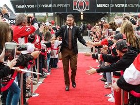 Senator captain Erik Karlsson gets the red-carpet welcome at Canadian Tire Centre on Saturday afternoon, but did not play in the game against the Red Wings.