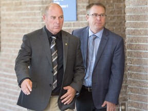 Train driver Thomas Harding, left, leaves the courtroom during a break on the first day of the Lac-Mégantic trial in Sherbrooke on Monday, Oct. 2, 2017.