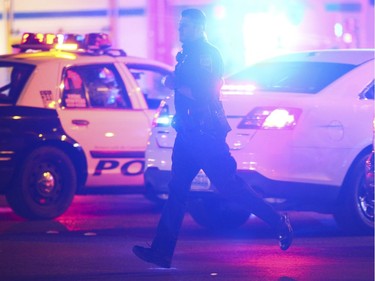 Las Vegas police respond during an active shooter situation on the Las Vegas Strip near Tropicana Avenue in Las Vegas Sunday, Oct. 1, 2017. Multiple victims were being transported to hospitals after a shooting late Sunday at a music festival on the Las Vegas Strip.