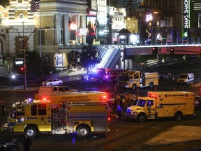 Las Vegas police and emergency vehicles sit on scene following a deadly shooting at a music festival on the Las Vegas Strip early Monday, Oct. 2, 2017. (Chase Stevens/Las Vegas Review-Journal via AP)