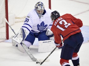 Toronto Maple Leafs goalie Frederik Andersen reaches for the puck against the Capitals' Jakub Vrana during the third period of their game Tuesday night in Washington. The Maple Leafs won 2-0.