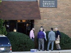 Officials stand outside the scene of a fatal shooting at a business park in the Edgewood area of Harford County, Md., Wednesday, Oct. 18, 2017. The victims and the suspect worked for Advanced Granite Solutions. (AP Photo/Patrick Semansky)