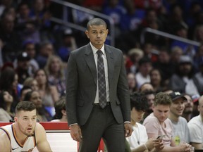 In this Oct. 21, 2017, photo, Phoenix Suns head coach Earl Watson watches action during the second half of an NBA basketball game against the Los Angeles Clippers in Los Angeles. The Suns have fired coach Watson just three games in to the NBA season. Phoenix announced the firing Sunday night, Oct. 22, after hours of meetings at the team's headquarters. (AP Photo/Jae C. Hong)