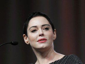 FILE- In this Oct. 27, 2017, file photo, actress Rose McGowan speaks at the inaugural Women's Convention in Detroit. An arrest warrant has been obtained for McGowan for felony possession of a controlled substance. The felony charge stems from a police investigation of personal belongings left behind on a United flight arriving at Washington Dulles International Airport on Jan. 20. (AP Photo/Paul Sancya, File)