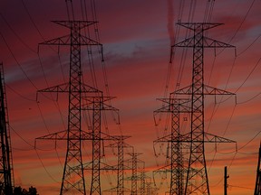 A colourful sky backdrops hydro transmission lines in Ottawa, Ontario on Wednesday September 30, 2015. Errol McGihon/Ottawa Sun/Postmedia Network 
// ADD: power electricity electrical wires transmission wires hydro pylons power grid  /pws