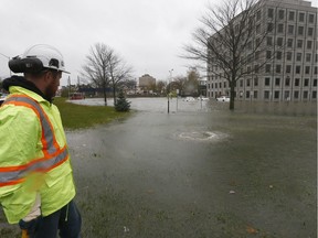 Ottawa city crews watch the water rise at the PEBB Building at 2197 Riverside Drive.