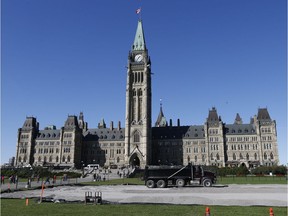 Construction crews begin building a skating rink on Parliament Hill on Thursday, Oct. 12, 2017.