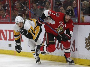 The Senators' Kyle Turris, right, battles with the Penguins' Olli Maatta during Gme 6 of the Eastern Conference final in May. Tony Caldwell/Postmedia