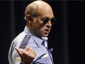 Jim Lahey, dressed as a police officer, talks about Ricky, Julian and Bubbles during the Trailer Park Boys Dear Santa Claus Go F#ck Yourself Tour at the Northern Jubilee Auditorium in Edmonton, Alta., on Monday, Dec. 15, 2014. The character is played by actor John Dunsworth.