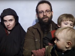 Screen capture from YouTube  of Taliban video showing hostages -Caitlan Coleman and Joshua Boyle with their children.