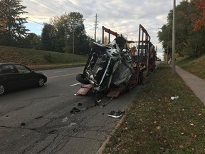 Police investigate after an over-height car carrioer clipped a number of traffic lights and an overpass.