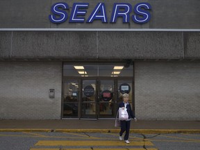 A shopper leaves the east exit of Sears at Devonshire Mall on Oct. 11, 2017.
