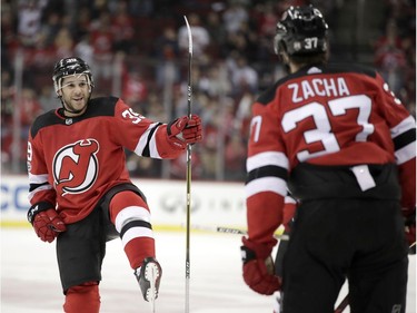 Devils forward Brian Gibbons, left, celebrates his goal with Pavel Zacha during the second period of the game against the Senators. AP Photo/Julio Cortez