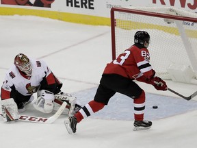 Devils winger Jesper Bratt scores a shootout goal on Senators netminder Mike Condon to win the game in Newark on Friday. AP Photo/Julio Cortez