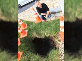Barrhaven resident Jeff Burnett, 33, was surprised to find a sinkhole had developed on his front lawn overnight, probably due to the heavy rains.
