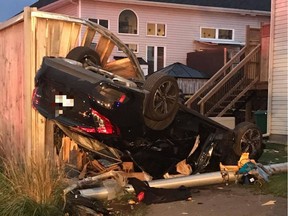 A car ended up in a yard on Maple Park Private after a rollover on Wednesday, Oct. 11, 2017.