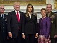 Donald and Melania Trump pose with Gen. Joseph Dunford (R), chairman of the joint chiefs of staff, and General Paul Selva (2nd L), vice chairman of the joint chiefs of staff, on October 5, 2017 in Washington, D.C.