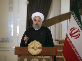 In this photo released by official website of the office of the Iranian Presidency, President Hassan Rouhani addresses the nation in a televised speech, in Tehran, Iran, Friday, Oct. 13, 2017. Rouhani spoke after U.S. President Donald Trump angrily accused Iran of violating the spirit of the 2015 accord and demanded Congress toughen the law governing U.S. participation. (Iranian Presidency Office via AP)