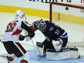 The Senators' Alex Formenton beats Jets netminder Connor Hellebuyck for a goal during a pre-season game on Sept. 27. Kevin King/Postmedia