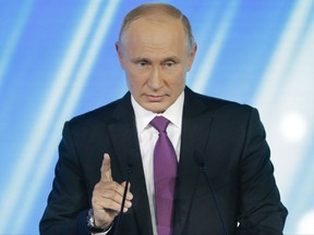 Russian President Vladimir Putin gestures speaking at a meeting of the Valdai International Discussion Club in Sochi, Russia, on Thursday, Oct. 19, 2017.