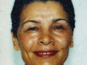 Zahra Kazemi, who died in an Iranian prison after being tortured, is shown in this undated passport photo