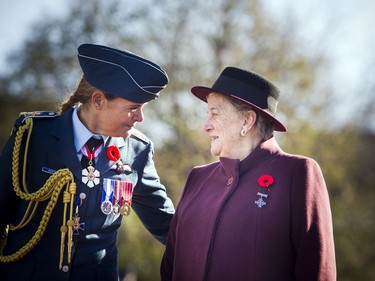 Governor General Julie Payette speaks with 2017 National Silver Cross Mother Diana Abel, right, during the National Remembrance Day Ceremony at the National War Memorial in Ottawa on Saturday, November 11, 2017.