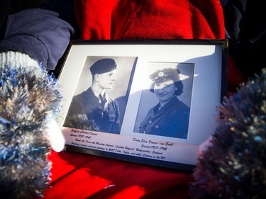 Doris Dancer spoke to media while holding historic photographs prior to the National Remembrance Day Ceremony at the National War Memorial in Ottawa on Saturday, November 11, 2017.