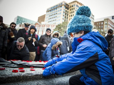 After the National Remembrance Day Ceremony people came to lay poppies and pay their respects at the Tomb of the Unknown Soldier at the National War Memorial in Ottawa on Saturday, November 11, 2017.